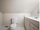 Simple bathroom with a toilet and vanity at 6118 Dora Dr, Mount Dora, FL 32757