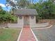 Small guest house with brick pathway at 6118 Dora Dr, Mount Dora, FL 32757