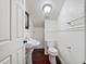 Small bathroom with pedestal sink and toilet at 6118 Dora Dr, Mount Dora, FL 32757