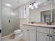 Clean bathroom with double vanity and shower at 6118 Dora Dr, Mount Dora, FL 32757
