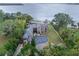 Luxury waterfront home with circular driveway, boat house, and stunning lake views at 6118 Dora Dr, Mount Dora, FL 32757