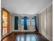Serene bedroom with water views and hardwood floors at 6118 Dora Dr, Mount Dora, FL 32757