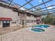 Resort-style pool and spa with expansive patio, screened enclosure and lake views at 6118 Dora Dr, Mount Dora, FL 32757