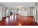Bright living room with hardwood floors, fireplace, and water views at 6118 Dora Dr, Mount Dora, FL 32757