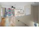 Spacious living room with hardwood floors and kitchen view at 6118 Dora Dr, Mount Dora, FL 32757
