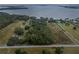 Large waterfront lot with mature trees and access to the lake at 6118 Dora Dr, Mount Dora, FL 32757
