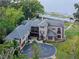 Luxury lakefront property featuring a spacious house, pool, and private dock at 6118 Dora Dr, Mount Dora, FL 32757