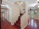 Unique curved staircase with decorative tile accents at 6118 Dora Dr, Mount Dora, FL 32757