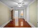 Bright bedroom with hardwood floors and ample closet space at 6118 Dora Dr, Mount Dora, FL 32757