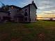 Lakefront home showcasing architectural details at sunset at 6118 Dora Dr, Mount Dora, FL 32757