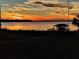 Stunning sunset view over the lake from the backyard at 6118 Dora Dr, Mount Dora, FL 32757