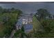 Luxury waterfront home boasting a circular driveway and beautiful lake views at 6118 Dora Dr, Mount Dora, FL 32757
