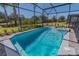 Relaxing screened pool and spa with ample surrounding space at 7319 Oakmoss Loop, Davenport, FL 33837