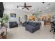 Spacious living room with sectional sofa and ceiling fan at 7350 Spring Mountain Ln, Yalaha, FL 34797