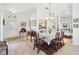 Elegant dining room with hardwood floors and large windows at 8001 Arcadian Ct, Mount Dora, FL 32757