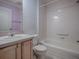 Bathroom with light wood vanity and bathtub at 8288 Se 177Th Winterthur Loop, The Villages, FL 32162