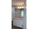 Bathroom boasts granite countertop and updated vanity at 928 Nuthatch Ave, The Villages, FL 32163