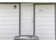 Front view of house with white siding and a simple door at 1109 S Smith Ave, Lakeland, FL 33815