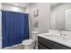 Clean bathroom with a shower/tub combo and dark vanity at 1109 S Smith Ave, Lakeland, FL 33815