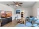 Bright living room with sectional sofa and large TV at 1109 S Smith Ave, Lakeland, FL 33815