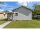 Side view of a charming house with a walkway at 1109 S Smith Ave, Lakeland, FL 33815