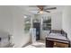 Bright Bedroom features a crib, dresser, and ample natural light at 1109 S Smith Ave, Lakeland, FL 33815