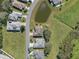 Aerial view of neighborhood with houses and pond at 21732 King Henry Ave, Leesburg, FL 34748