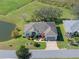 Single-Gathering home on a golf course with a pond view at 21732 King Henry Ave, Leesburg, FL 34748