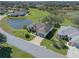 Aerial view of a single-Gathering home with pond views in a golf course community at 21732 King Henry Ave, Leesburg, FL 34748