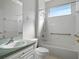Bathroom with a single sink vanity, shower/tub combo, and grab bars at 21732 King Henry Ave, Leesburg, FL 34748