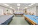 Bright billiards room with multiple pool tables at 21732 King Henry Ave, Leesburg, FL 34748