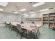 Craft room with tables, chairs, and storage cabinets at 21732 King Henry Ave, Leesburg, FL 34748