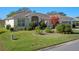 Well-maintained house with lush landscaping at 21732 King Henry Ave, Leesburg, FL 34748