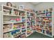Game room with shelves filled with board games and puzzles at 21732 King Henry Ave, Leesburg, FL 34748