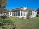Well-maintained house with a large sunroom and backyard at 21732 King Henry Ave, Leesburg, FL 34748