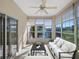 Bright sunroom overlooking the pool and golf course at 21732 King Henry Ave, Leesburg, FL 34748