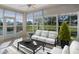 Relaxing sunroom with water views and comfy furniture at 21732 King Henry Ave, Leesburg, FL 34748