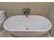 Modern freestanding bathtub with black faucet at 2602 Cr 422, Lake Panasoffkee, FL 33538
