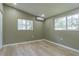 Bright bedroom with light wood flooring and large windows at 2602 Cr 422, Lake Panasoffkee, FL 33538