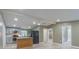 Modern kitchen featuring gray cabinets, granite countertops, and a kitchen island at 2602 Cr 422, Lake Panasoffkee, FL 33538