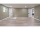 Spacious living area with light wood flooring and neutral walls; access to other rooms at 2602 Cr 422, Lake Panasoffkee, FL 33538