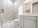 Modern bathroom with shower, toilet, and double vanity at 39851 & 39855 Darlington Ave, Lady Lake, FL 32159