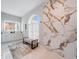 Elegant bathroom with marble shower, double vanity, and modern fixtures at 39851 & 39855 Darlington Ave, Lady Lake, FL 32159