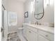 Clean bathroom with white vanity and marble accents at 39851 & 39855 Darlington Ave, Lady Lake, FL 32159