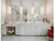 Elegant bathroom with double vanity, marble, and large mirrors at 39851 & 39855 Darlington Ave, Lady Lake, FL 32159