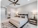 Bright bedroom with king-size bed, neutral decor and a ceiling fan at 39851 & 39855 Darlington Ave, Lady Lake, FL 32159