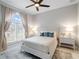 Bright bedroom with large window and neutral decor at 39851 & 39855 Darlington Ave, Lady Lake, FL 32159