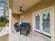 Relaxing covered patio with seating area, tile flooring and view of the backyard at 39851 & 39855 Darlington Ave, Lady Lake, FL 32159