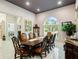 Formal dining room with large arched window and elegant furnishings at 39851 & 39855 Darlington Ave, Lady Lake, FL 32159