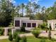 Three-car garage with modern doors and landscaping at 39851 & 39855 Darlington Ave, Lady Lake, FL 32159